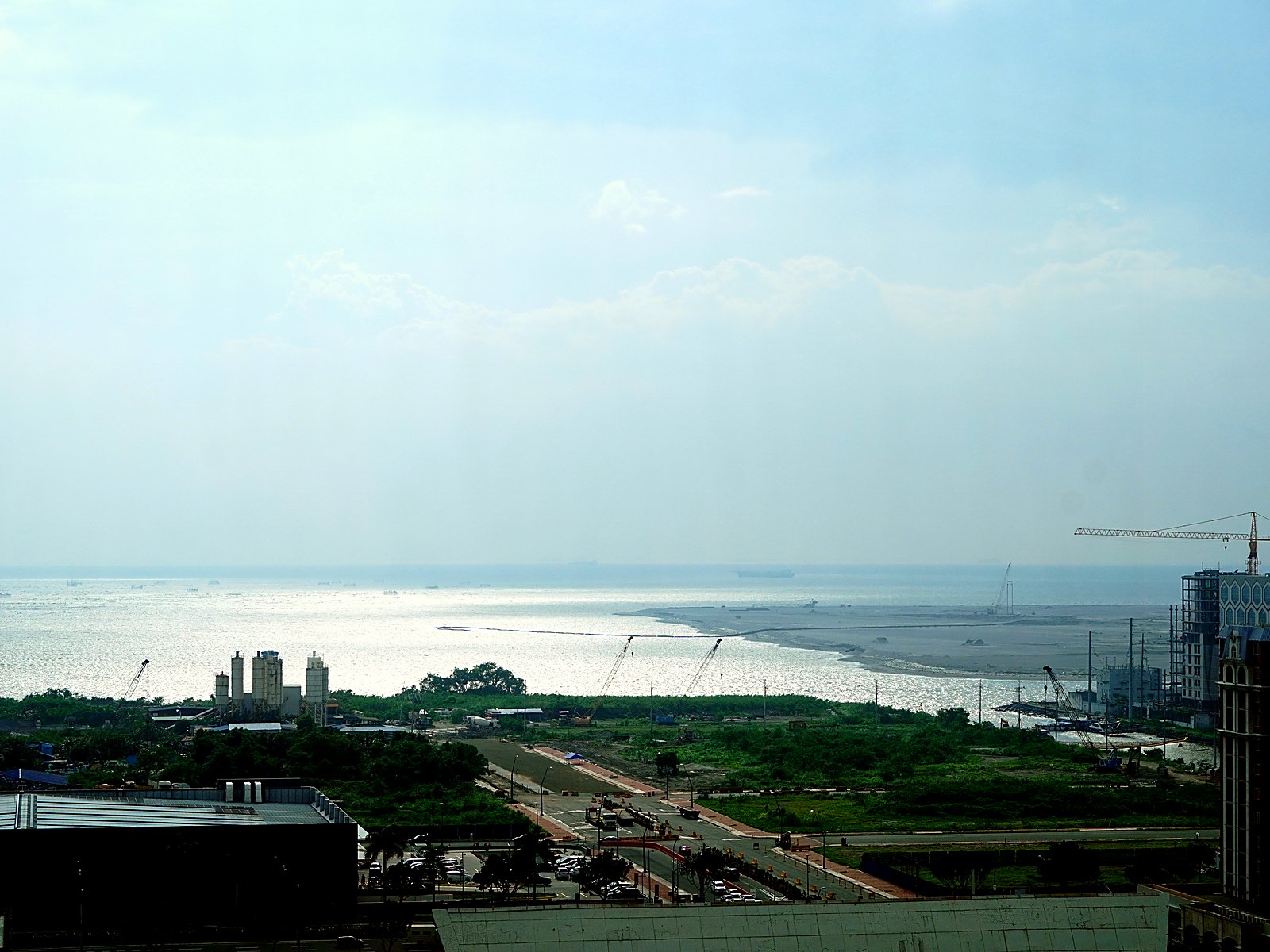 Sinocan Corporate Center — Manila Bay from the Upper Floors